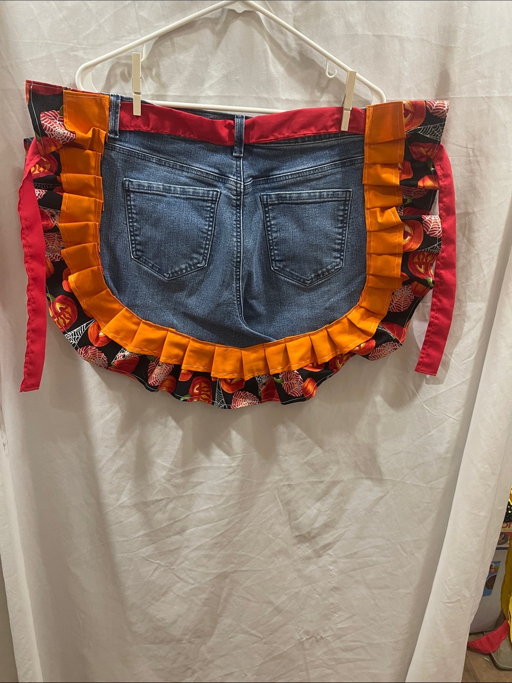 Women’s Denim Apron-Style Jeans Skirt with Orange Ruffle Trim